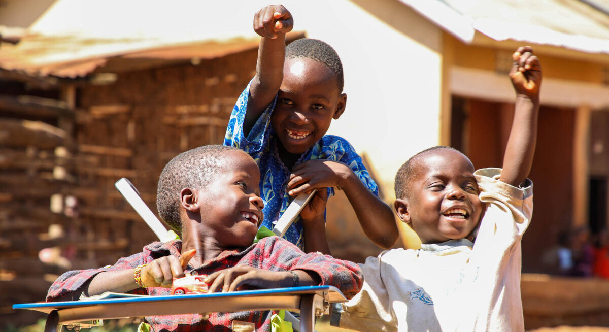 Children with disabilities smiling and celebrating