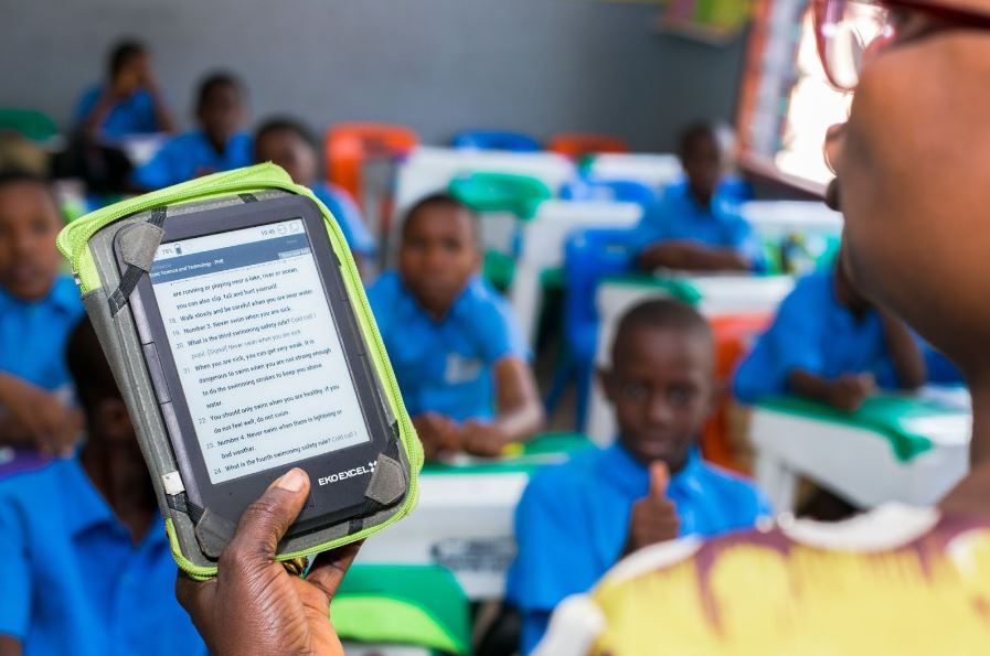 Teacher using an e-reader with students in class