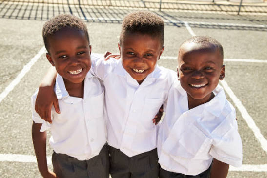 School children smiling with confidence