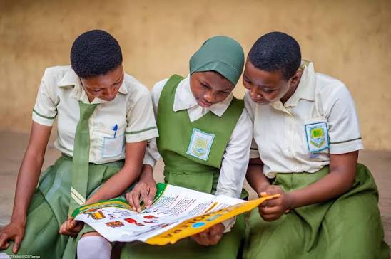 Students learning about health from educational materials
