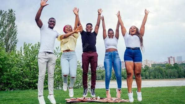 Young people celebrating achievement together