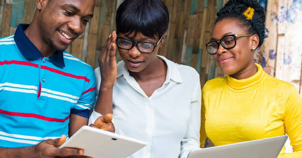 Young people collaborating with digital tools